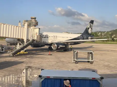 Plane at a jet bridge at Sangster International Airport (MBJ), Montego Bay