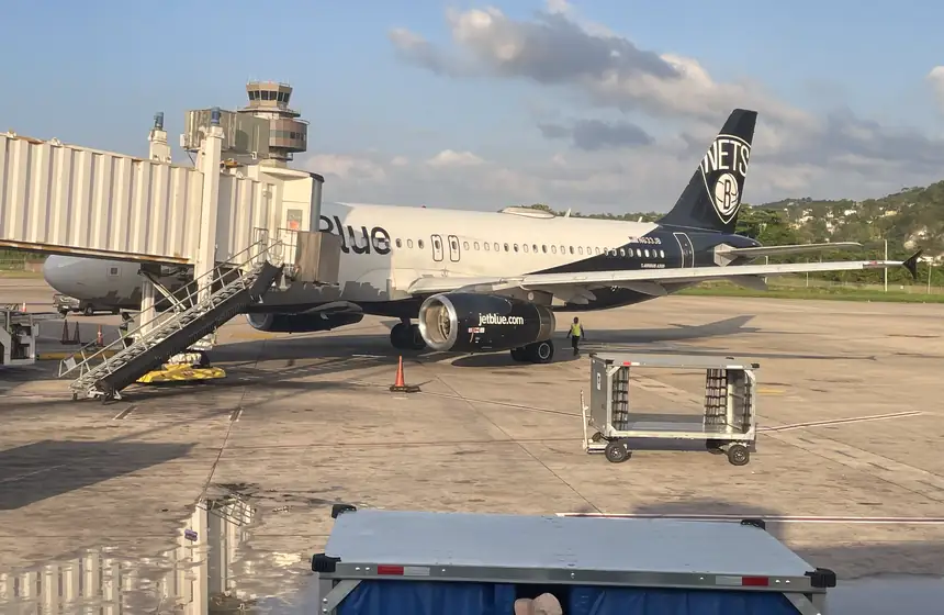 Plane at a jet bridge at Sangster International Airport (MBJ), Montego Bay