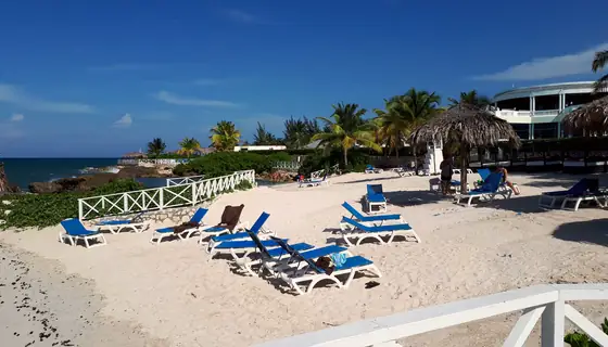 Sun loungers on a white-sand beach in Montego Bay