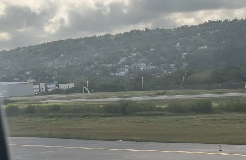 Runway at Sangster International Airport (MBJ) with the Montego Bay hills