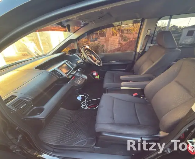 Inside the Ritzy Tours JA van, front seats